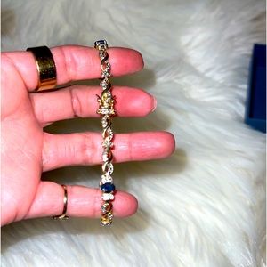 Yellow Gold Tone Infinity diamond accent with black diamond tone.